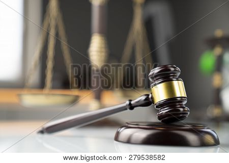 Lawyers Office. Gavel And Scale  On The White Table.