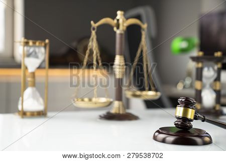 Lawyers Office. Gavel And Scale  On The White Table.