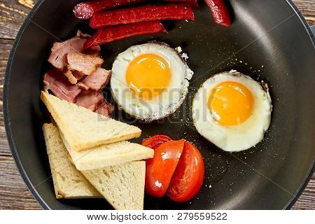 Closeup Pan With Different Food. Juicy Fried Food On Pan.