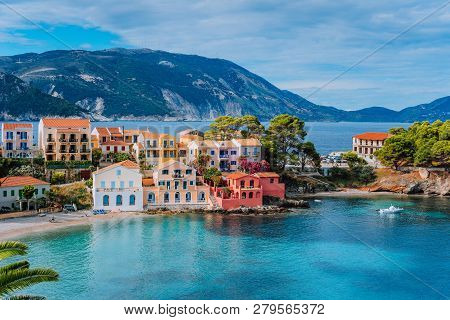 Beautiful Panoramic View Of Assos Village With Vivid Colorful Houses Near Blue Turquoise Colored And