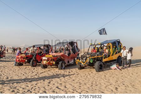 Huacachina, Peru - June 1, 2015: Tourists On Sand Dune Buggy Trip To The Dunes In Huacachina Desert,