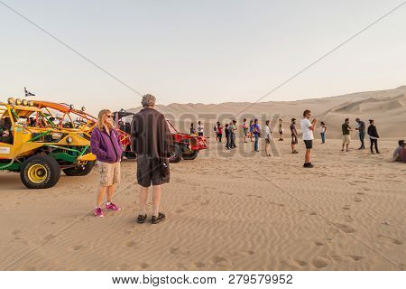 Huacachina, Peru - June 1, 2015: Tourists On Sand Dune Buggy Trip To The Dunes In Huacachina Desert,