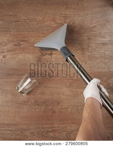 Removing Water Spill From Dark Wooden Floor Surface