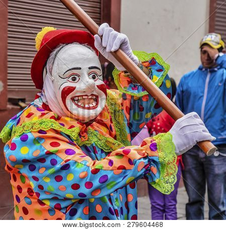 Latacunga, Ecuador - September 22, 2018 - A Clown Leads Each Neighborhood Group In The Mama Negra Pa