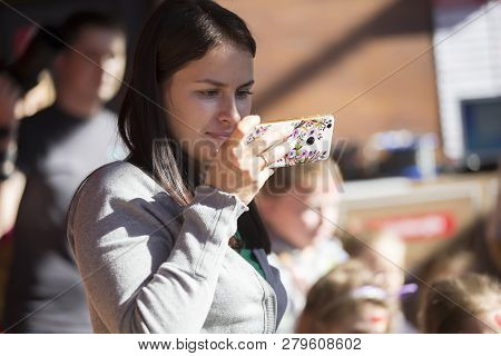 Belarus, Gomel, October 13, 2018. Holiday In The City. Public Dining.woman Taking A Picture With A M