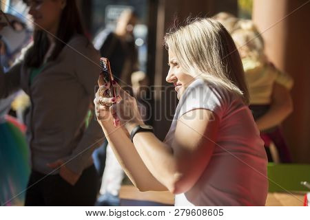 Belarus, Gomel, October 13, 2018. Holiday In The City. Public Diningn.woman Taking A Picture With A 