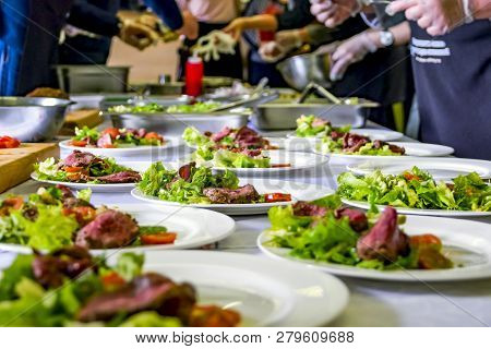 Cooked Roast Beef, Fresh Salad And Tomatoes Served On White Plates. Cooking Master Class, Workshop W