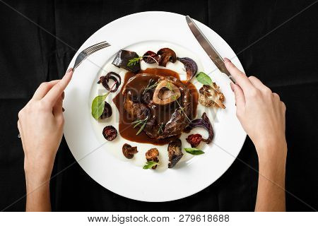 Top View Of Meat Dish With Grilled Vegetables. Female Hands Holding Cutlery. Grilled Beef With Veget
