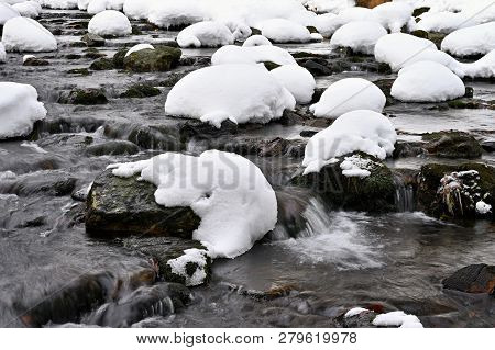 Winter Stream With Stones And Snow. A Beautiful Winter Concept For Winter And Frost.