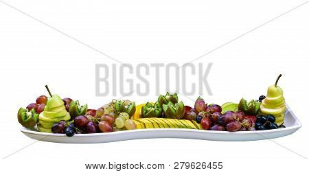 Sliced Mixed Fruit On The White Plate, White Background Isolated