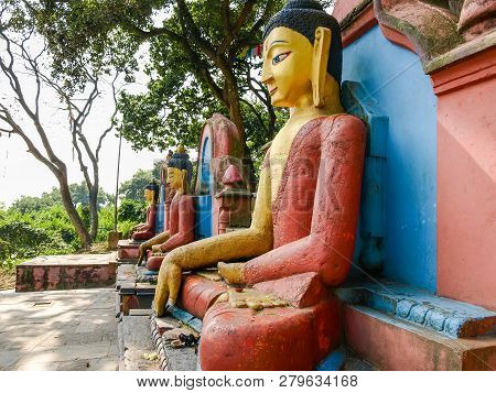 Buddha Statues At The Eastern Foot Of The Swayambu Hill In The Buddhist Swayambhunath Temple Complex