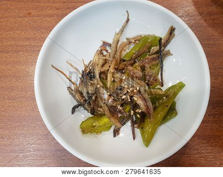 Korean Food Style, Top View Of Anchovy Stir Fried With Green Pepper, Sprinkled With Sesame Seeds On 