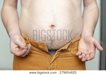 Fat Person Tore Off A Button, Trying To Fasten Old Pants, Was Surprised And Thought About Going To T