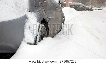 Passenger Car Stuck In Snow, Side View. Car Blocked In The Yard By Snowdrift After Heavy Blizzard. B