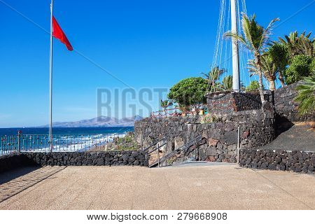 Puerto Del Carmen Beach In Lanzarote, Canary Islands, Spain. Blue Sea, Palm Trees, Selective Focus