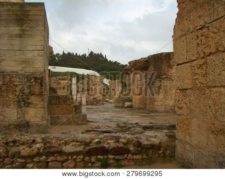 Carthage, Tunisia - April 12, 2018: Ruins Of Bathhouse Of Carthage And View To Mediterranean Sea, Tu