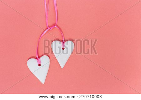 Two White Coupled Hearts On Paper Background. Holiday Concept For Wedding Or Valentine’s Day.