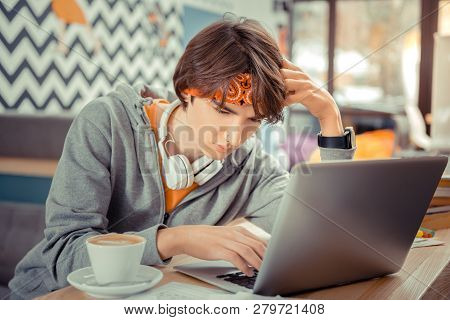 Young Junior Programmer Thinking On The Difficult Task