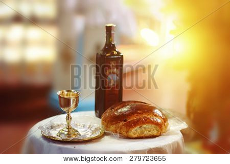 Holy Communion On Wooden Table In Church.taking Communion.cup Of Glass With Red Wine, Bread On Table