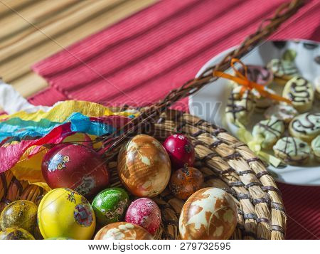 Czech Republic, Prague, April 4, 2018: Homemade Colorful Painted Easter Eggs In Straw Flat Basket, E