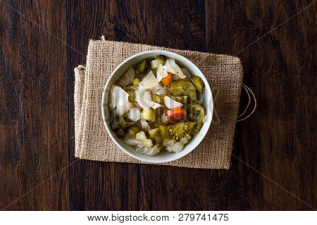 Mix Of Turkish Pickles With Hot Green Pepper, Cabbage, Sauerkraut, Carrot And Cucumber In Bowl.