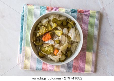 Mix Of Turkish Pickles With Hot Green Pepper, Cabbage, Sauerkraut, Carrot And Cucumber In Bowl.