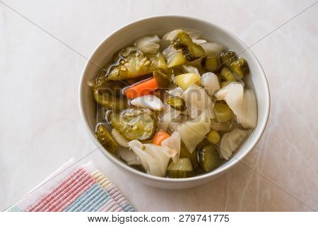 Mix Of Turkish Pickles With Hot Green Pepper, Cabbage, Sauerkraut, Carrot And Cucumber In Bowl.