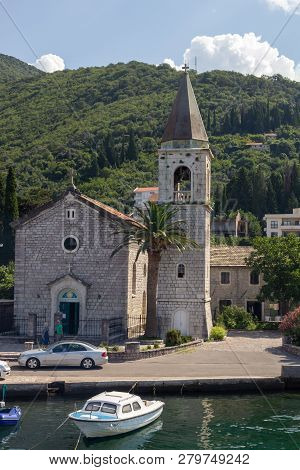 Donja Lastva, Tivat, Montenegro, August 06, 2014: The Catholic St. Roko Church, Ancient Stone Houses