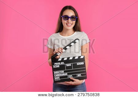 Woman With 3d Glasses And Clapperboard On Color Background. Cinema Show