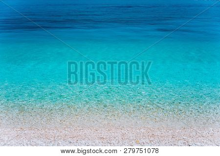 Abstract Image Of Clear Blue Sea Water Beautiful Background Decoration Of Summer Time. Clear Transpa
