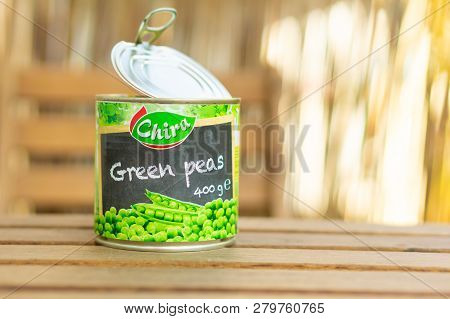 Poznan, Poland - October 10, 2018: Chira Green Peas In A Open 400 Gram Can On A Wooden Table