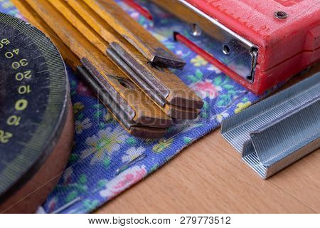 Tacker And Staples Used To Upholster Furniture. Accessories For Employees In The Carpentry Shop.