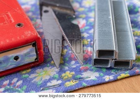 Tacker And Staples Used To Upholster Furniture. Accessories For Employees In The Carpentry Shop.