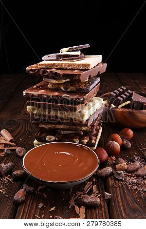 Chocolate Bars On Table With Chocolate Tower.