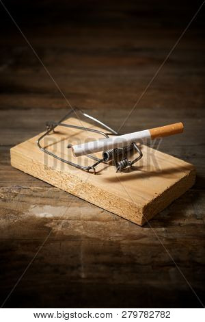Cigarette on a mouse trap.