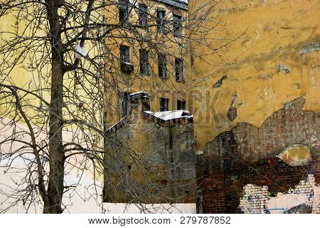 Slum And Ghetto Street View In Winter Time And Snow Weather With Abandoned Buildings