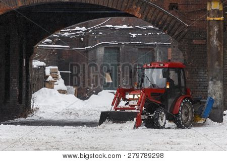 Red Snowblower Clears Snow From The Street After A Big Snowstorm, Front View/ Snowy Winter, Snowthro