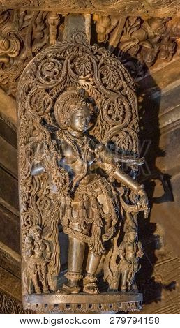 Belur, Karnataka, India - November 2, 2013: Chennakeshava Temple Building. Black Stone Statue Of Fem