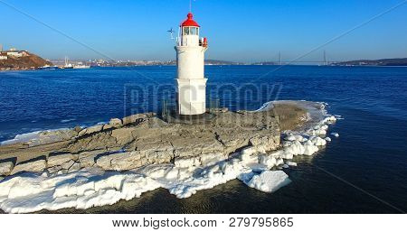Aerial Photography Tokarev Lighthouse On The Background Of The Blue Sea. Vladivostok, Russia.