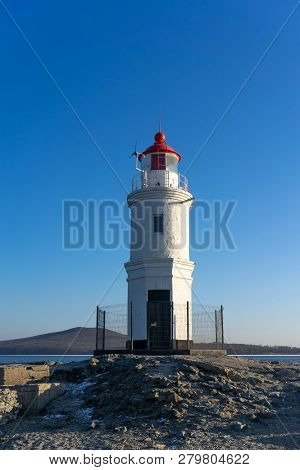 Seascape Overlooking The Tokarev Lighthouse Against The Blue Sky.