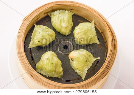 Steamed Shrimp Dumplings Flavoured With Basil In Bambo Basket