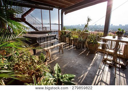 Johannesburg, South Africa, 18th January - 2019: Terrace View With A Piano And Tables In Entertainme