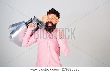 Man Bearded Hipster With Lot Shopping Bags. Shopping On Black Friday. Happy Shopping With Bunch Pape