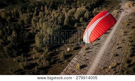 Paraglider Flies Over Fields. High Altitude. The Athlete Turns The Thermal Current. Rise Up. Weather