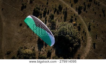 Paraglider Flies Over Fields. High Altitude. The Athlete Turns The Thermal Current. Rise Up. Weather