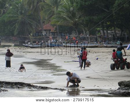 Anyer, Indonesia - June 26, 2018: Many People Getting Activities On Sambolo Beach.