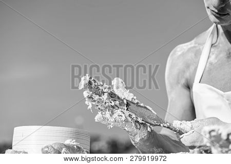 Hands Of Muscular Baker Or Cook Kneading Raw Sticky Dough. Hands Of Chef Cook Working With Sticky Do