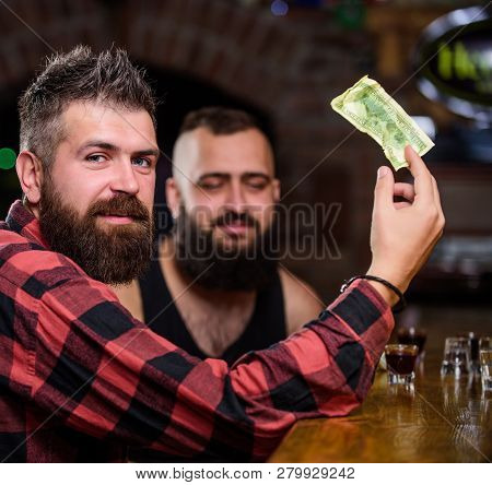 Friends Relaxing In Pub. Hipster Brutal Bearded Man Spend Leisure With Friend At Bar Counter. Order 