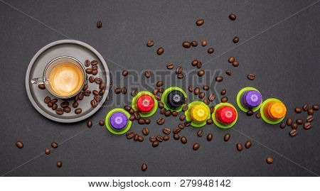 Espresso Coffee Cup, Beans And Capsules, Pods, On Black Color Background