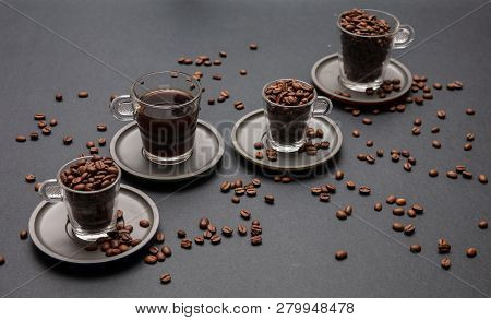 Coffee Cups And Beans On Black Color Background